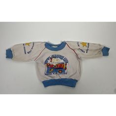 Vintage Peanuts Snoopy Aviation Club Baby Sweater. White With Blue Trim Around Neck Arms And Hem. Red Piping On Shoulder/ Sleeve Area. Snoopy And Woodstock In Plane / Sky Graphic On Front. World Wide Flyers. Small Print On Front That Reads: 1985, 1977? United Feature Syndicate, Inc. Both Arms Have A Yellow Star And Blue Font That Reads Snoopy Aviation Club World Wide Flyers. Approx. Measurements: Pit To Pit: 9.5 In / 25 Cm Shoulder To Hem: 10 In / 26 Cm I Assume It Is Polyester But Unsure. Pleas Peanuts Shirts, In Plane, Star Sweatshirt, Blue Font, Peanuts Snoopy Woodstock, Yellow Star, Vintage Baby Clothes, Snoopy Woodstock, Baby Sweater