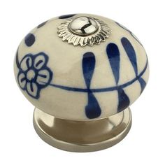 a blue and white knob with an ornate design on it