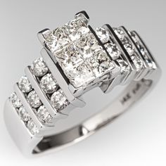 a white gold ring set with princess cut diamonds