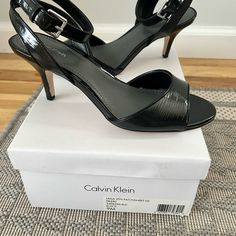 New Calvin Klein Black Laila Open Toe Sandal With Ankle Strap And 2.5 In Heel. Never Worn. Fitted Open Toe Calvin Klein Heels, Calvin Klein Sandals With Heel Strap And Round Toe, Ankle-high Sandals With 4-inch Heel And Medium Width, Medium Width Ankle-high Sandals With 4-inch Heel, Calvin Klein Sandals With Ankle Strap And Heel Strap, Calvin Klein Ankle Strap Sandals With Heel Loop, Calvin Klein High Heel Sandals With Heel Strap, Calvin Klein Open Toe Formal Sandals, Calvin Klein Leather Ankle Strap Heels