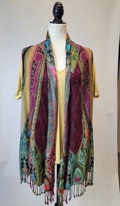 Be the life of the party with this multi-colored fringe vest! Step out in unique style with this show-stopping sleeveless statement piece. Perfect for adding a punch of color to any look, you won't ever be stuck in a style rut again! (Or, you know, just really make a statement.) Spring Party Sweater Vest Sleeveless, Multicolor Sweater Vest For Summer, Fitted Fringe Summer Vest, Fitted Fringe Vest For Summer, Fitted Summer Vest With Fringe, Multicolor Spring Vest, Multicolor Summer Sweater Vest, Multicolor One Size Tops For Layering, One Size Multicolor Tops For Layering