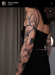 a woman's arm with flowers on it