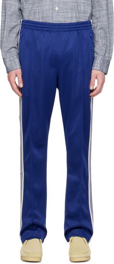 Polyester interlock jersey track pants. · Concealed drawstring at elasticized waistband · Three-pocket styling · Logo graphic embroidered at front · Pinched seam at legs · Striped knit trim at outseams Supplier color: Royal Needles Track Pants, Striped Knit, Logo Graphic, Track Pants, Apparel Accessories, Track, Trim, Outfit Accessories, ? Logo