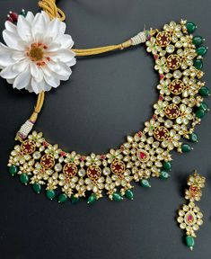 Gorgeous Hyderabadi Gold and green Necklace perfect for any occasion! A very high quality and modern luxurious look for any jewelry lover! This necklace comes with matching earrings that are perfect to wear alone for a lighter look. The colors are very festive and bright enough to sparkle any outfit, yet not overpower the look as the antique gold finish gives real gold look! The necklace is perfect to wear with any saree, lehenga or even style as a indo western look for weddings and occasions. T Green Emerald Bridal Necklace Gift, Elegant Green Kundan Necklace For Festive Occasions, Elegant Emerald Kundan Necklace For Gift, Dazzling Necklace With Matching Earrings For Gifts, Dazzling Necklaces With Matching Earrings For Gifts, Dazzling Green Jewelry For Gift, Green Jewelry Sets As A Gift, Dazzling Green Jewelry For Gifts, Kundan Green Jewelry Gift