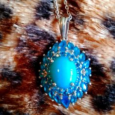 Stunning, Stunning, Stunning Natural Arizona Sleeping Beauty Turquoise (Oval 11 X 9 Mm) Malgache Neon Apatite Cocktail Pendent Necklace With A 20 In Chain. All Set In Platinum Vermeil Over Sterling Silver ( 7g ) 5.15 Ctw Est. Retail: 1350.00 Nwt. Nib. The Sleeping Beauty Mine Is Now Closed Turquoise Is The Birthstone For The Month Of December This Is A Wonderful Opportunity To Own A Piece Of American History Blue Oval Multi-stone Gemstones, Oval Blue Multi-stone Gemstones, Luxury Blue Cabochon Gemstones, Luxury Blue Gemstones With Accents, Exquisite Blue Teardrop Jewelry, Formal Cabochon Blue Topaz Jewelry, Exquisite Blue Sterling Silver Necklace, Exquisite Blue Cabochon Jewelry, Blue Gemstones With Accents Fine Jewelry