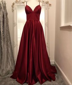 V-neck Gown For Red Carpet And Prom Season, Burgundy Satin V-neck Dress, Red Satin V-neck Gown, Satin Evening Dress For Prom And Red Carpet, Satin Evening Dress For Red Carpet And Prom Season, Satin Gown For Red Carpet Prom Season, Satin Gown For Red Carpet Or Prom, Red Carpet Satin Evening Dress With Fitted Bodice, Red Carpet Satin Gown With Fitted Bodice