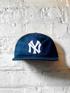 Vintage New York Yankees Hat- (New) Cotton Unstructured 6 Panel Snapback in Navy - (New) Cotton Unstructured 5 Panel Snapback in Charcoal Closure - 7 Button Plastic SnapColor - Navy & Charcoal Contents - 60% Cotton / 40% PolyesterProfile - 3.25"Size - One Size Fits All (6 ⅝” – 7 ⅝”)Structure - Lightly Structured- Flocked Yankees Patch Vintage Yankees, New York Yankees Hat, Hat New York, New York Hat, Ny Hat, New York Yankee Hat, Yankees Hat, Vintage New York, New York Yankees