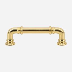 an image of a brass handle for a cabinet door or drawer with two handles on each side