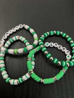 Handmade clay beaded bracelets. These are perfect for St. Patrick's Day to get into the holiday season and to make sure you are always wearing green. Green Heart Beads Bracelet Jewelry, Green Heart Beads Bracelet, Green Stretch Bracelet With Colorful Heishi Beads, Casual Green Bracelets With Spacer Beads, Green Casual Beaded Bracelets With Spacer Beads, Green Heishi Beads Stretch Bracelet Gift, Casual Green Beaded Bracelets With Spacer Beads, Green Heishi Beads Stretch Bracelet With Colorful Beads, Casual Green Bracelet With Spacer Beads