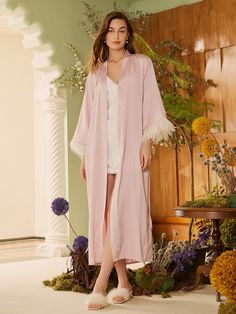 Stay elegant, stay indulgent, and embrace the beauty of pure luxury. Carefully designed and tested by our designers and models, this pink silky robe offers a great combination of comfort and style. With its exquisite craftsmanship and timeless appeal, it makes a thoughtful and memorable present for any occasion. Celebrate important events with our bridal collection — our one of a kind wedding style robes are made to make you feel as special as you are on such memorable days. - A stunning silk, l Feather Bridal Robe, Silky Robe, Bridal Party Robes, Bridal Robe, Pink Bridal, Pink Feathers, Silk Robe, Luxury Bridal, Bridal Robes