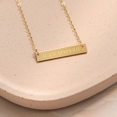 The daintiness of our "personalized roman numerals" necklace adds the perfect touch to any outfit! The simplicity of this custom necklace allows you to mix and match with a variety of styles to create an elegant look. Beautifully engraved, this customized piece makes the perfect gift for Valentine’s Day, Mother’s Day, Christmas, Wedding and all special occasions and milestones! Material: 14k gold filled, anti-tarnish material (will not turn blue or green and will not stain skin) Bar Size: 1.25” Rainbow Bar, Skin Bar, Engraved Bar Necklace, Christian Necklace, Turn Blue, Script Monogram, Modern Couple, Gold Bar Necklace, Monogram Necklace