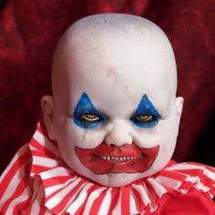 a close up of a person wearing clown makeup on a red and white striped background