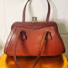 I Found This Amazing Vintage Handbag From Circa 1940/1950 I Think I'm Just Sharing It. Not Sure If I Want To Sell It Yet. I Am Open To Offers Though. Vintage Satchel With Detachable Handle For Everyday, Vintage Business Satchel With Gold-tone Hardware, Vintage Cognac Satchel Bag, Vintage Brown Antique Bag For Formal Occasions, Business Vintage Bags With Gold-tone Hardware, Retro Formal Bags With Brass Hardware, Vintage Brown Formal Bag, Antique Vintage Brown Formal Bag, Elegant Vintage Brown Satchel For Everyday