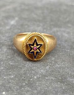 An Antique Victorian 14ct gold signet statement ring. The ring face is set with a blue enamel star with a little pink ruby in the center. The star is slightly moving to the right and left but is secure and isn't loose or come of. The ring is hollow worked in a very good quality and old craftsmanship. Inner Diameter is 17,2mm to 17,5mm Approx. sizes: German 54, UK N & US 6.8 Weight: 3,87gr The ring shows patina and had obviously been resized at one point. The pictures are a part of the descriptio Ruby Signet Ring, The Ring Face, Pink Ruby, Star Ruby, Gold Enamel, Antique Victorian, Signet Ring, Rings Statement, Crystal Jewelry