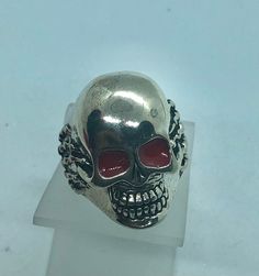 Red eyes skull Ring Biker skull Ring Brand New.   Hand claw details  Sizes Available:  6,7,8,9,10,11,12,13,14 and 14 1/2. By Zevria Jewelers Biker Style Skull Jewelry, Punk Skull Ring For Biker Events, Punk Skull Ring For Streetwear, Punk Style Skull Ring For Halloween Collectible, Silver Skull Ring For Biker Events And Halloween, Silver Punk Skull Ring, Punk Skull Ring For Halloween Streetwear, Edgy Skull Ring As A Gift, Silver Skull Ring For Streetwear