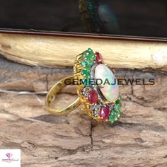 AAA+ Quality Opal Gemstone Ring, Emerald 925 Silver Ring, Ruby Gemstone Jewelry, Pave Diamond Ring, Gold Vermeil Jewelry, Wedding Jewelry Gross Weight: 12.01 gram Gemstone Weight: 17.10 cts Diamond Weight: 0.60 cts Ring Size: 33X27 MM NOTE:- All The Products Are Designed And Manufactured In My Workshop By Me & My Team. Shown Products Are Purely Handmade. Custom Orders Are Open Handly Accepted. We Are the Perfect Choice For Any Custom Jewelry Manufacturing. For Bulk Orders Please Message me. Fine Jewelry Opal Ring With Multi-stone For Anniversary, Sterling Silver Multi-stone Opal Ring For Wedding, Wedding Opal Ring With Multi-stones In Sterling Silver, Multi-stone Cubic Zirconia Emerald Ring For Wedding, Fine Jewelry Gemstones With Stone Setting For Wedding, Oval Gemstones With Stone Setting For Wedding, Oval Gemstones For Wedding Stone Setting, Fine Jewelry Wedding Gemstones With Stone Setting, Oval Wedding Gemstones With Stone Setting