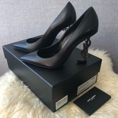 Saint Laurent Opyum Ysl Pointy Toe Black Leather Bronze Gold Heel Pump New Never Worn! Come With Box , Dust Bag , Authenticity Card Size : 38.5 Run Half Size Small Designer Almond Toe Heels For Night Out, Designer Evening Court Shoes With Padded Heel, Designer Party Court Shoes With Branded Heel, Designer Leather Court Shoes For Party, Designer High Heel Court Shoes With Branded Insole, Luxury Almond Toe Court Shoes For Night Out, Luxury Round Toe Court Shoes For Night Out, Luxury Leather Court Shoes For Night Out, Designer Court Shoes With Sculpted Heel