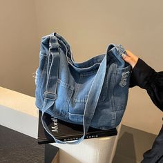 Experience style and functionality with our Denim Canvas Messenger Bag! Measuring 31cm Tall x 40cm Wide(12in x 15in) and featuring a 12cm(4.5in) thickness, this bag is perfect for carrying your essentials while on-the-go. The adjustable strap makes this a must-have option. Stay organized and stylish with this amazing bag. Product Images: Canvas Messenger Bag, Stay Organized, Product Images, Movies And Tv Shows, Messenger Bag, Shoulder Bags, Adjustable Straps, Navy Blue, Shoulder Bag