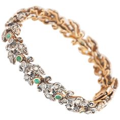 An antique Edwardian 18 karat gold and silver link bracelet set with vibrant emeralds and diamonds. The bracelet consists of fourteen faceted emerald stones with a vivid green color. The emeralds are surrounded by many diamonds. The bracelet is beautifully linked together in an 18k gold and silver bezel setting. Once the bracelet is secured, there is also an eight-safety pin at the closure. Emerald symbolism encompasses not only royalty but also wit, eloquence, and foresight. Emerald symbolism e Retro Bracelet, Silver Link Bracelet, Gold Link Bracelet, Gold Armband, Floral Bracelet, Gold Link, Jade Carving, Emerald Stone, Vibrant Green