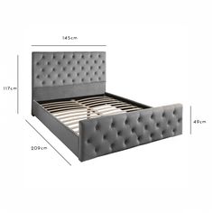 the bed frame is upholstered and has buttons on each side, along with an attached headboard