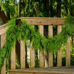 Western red cedar garland hanging from banister with chestnut garland tie Fresh Christmas Garland, Cedar Garland, Fresh Christmas Wreath, Fresh Garlands, Led Garland, Outside Christmas Decorations, Window Wreath, Holiday Garland, Festive Holiday Decor