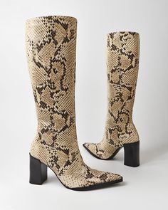 Add some boldness to your looks Chic Fall Knee-high Boots With Block Heel, Fall Leather Heeled Boots With Snake Print, Chic Knee-high Boots With Block Heel For Fall, Leather Heeled Boots With Snake Print For Fall, Chic Snake Print Boots With Block Heel, Fall Snake Print High Heel Boots, High Heel Snake Print Boots For Fall, Snake Print High Heel Boots For Fall, Fall Party Boots With Snake Print