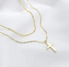 Super cute and dainty tiny cross charm on dainty chain 18k gold plated, Silver plated, 18k gold filled, or sterling silver. Gold vermeil sterling silver charm. Hypoallergenic nickel & lead free material -Silver plated cable chain -Silver plated satellite chain -18k Gold plated cable chain -18k Gold plated satellite chain -Sterling silver cable chain (read description below) -14k gold filled cable chain (read description below) Simple, Dainty, Delicate, yet so Elegant and Romantic. The shine Dainty Gold Cross Pendant Necklace, Delicate Gold Cross Jewelry, Gold Adjustable Minimalist Cross Necklace, Gold Dainty Cross Necklace With Adjustable Chain, 14k Gold Filled Layered Clavicle Chain Necklace As Gift, 14k Gold-filled Layered Clavicle Chain Necklace As Gift, Gift 14k Gold Filled Layered Clavicle Necklace, Dainty Cross Necklace With Delicate Chain, Gold Delicate Cross Charm Necklaces