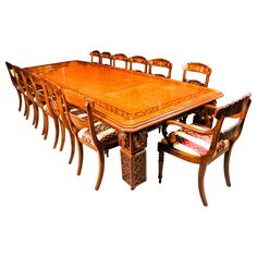 a large wooden table and chairs with matching upholstered cushions on the seats is shown