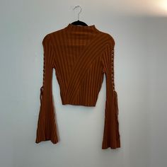 Lace Up Mock Neck Sweater Color: Copper Fitted Ribbed Brown Outerwear, Fitted Brown Ribbed Outerwear, Brown Cropped Top For Fall, Fitted Brown Sweater For Spring, Cropped Spring Tops, Brown Ribbed Tops For Fall, Ribbed Brown Tops For Fall, Brown Stretch Sweater For Spring, Lavender Sweater