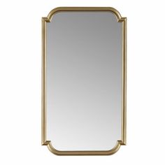 a gold framed mirror on a white background with the reflection of an arch in it