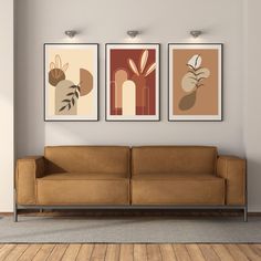 three art prints hang on the wall above a couch