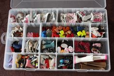 a plastic box filled with lots of different types of shoes and other things in it