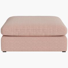 the footstool in pink fabric with black legs