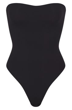 Sculpt your natural shape with a strapless double-layered bodysuit from Kim Kardashian's SKIMS that holds you in and lifts you up with comfortable support. Reflecting the brand's passion for highly technical shapewear solutions for every body, this everyday piece has buttery-soft seamless construction, inner elastic at the top to help keep it in place, high-cut legs and a thong back that remains invisible under clothing. Strapless Includes adjustable bra straps lined gusset 76% polyamide, 24% elastane Machine wash, tumble dry Imported Strapless Shapewear, Strapless Bodysuit, Adjustable Bra, Space Girl, Concert Fits, Crop Top Outfits, Bra Straps, Beach Wears, Black Bodysuit