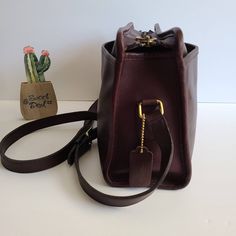 "Vtg Coach Original Swagger Bag Burgundy leather with brass hardware Roomy interior with inner slip pocket secured with a top zipper. 2 full size slip pockets on both sides Adjustable 44\" shoulder strap Measures: 11.5\"L, 7\"H, 4\"W Made in New York, USA #296-4839 Cleaned, conditioned and ready to wear! Questions? Just ask More vtg coach styles/colors also available G31" Classic Bags With Brass Hardware For On-the-go, Classic Satchel With Brass Hardware In Tote Shape, Classic Satchel With Brass Hardware, Classic Tote Satchel With Brass Hardware, Classic Satchel Tote With Brass Hardware, Classic Burgundy Shoulder Bag For Travel, Classic Burgundy Satchel With Leather Lining, Classic Burgundy Bag With Zipper Closure, Classic Burgundy Shoulder Bag With Zipper Closure