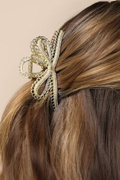 Finish any look with the Lulus Utterly Charming Gold Rhinestone Pearl Bow Claw Hair Clip and compliments will follow wherever you go! Shiny gold-toned metal shapes this darling claw clip that features a bow-inspired silhouette, embellished with dainty rhinestones, gleaming faux pearls, and lace-like scalloped-edge trim for a luxe touch. 4" Long. 70% Iron, 20% Stone, 10% Plastic. Imported. Lulus | Utterly Charming Gold Rhinestone Pearl Bow Claw Hair Clip. Pearl Bow, Claw Hair Clips, Hair Claw Clip, Gold Rhinestone, Bow Hair, Hair Claws & Clips, Claw Clip, Scalloped Edge, Hair Claw