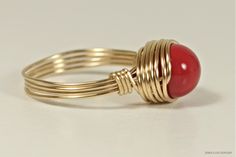 Red Coral Swarovski Pearl Ring Handmade by Jessica Luu Jewelry ~ Elegant ~ Classic ~ Simple ~ Have this red coral pearl solitaire ring made just for you - available in 14K rose and yellow gold filled. MATCHING ITEMS https://www.etsy.com/shop/JessicaLuuJewelry?search_query=red+coral+pearl DETAILS: ~ 8mm red coral Swarovski pearl ~ 14K yellow or rose gold filled wire HOW IT'S MADE: Each ring is handmade to order using U.S. standard jewelry sizing equipment to ensure the correct size with 14K gold Red Adjustable Wire Wrapped Rings, Adjustable Red Wire Wrapped Rings, Elegant Red Pearl Ring For Anniversary, Red Coral Ring, Red Coral Jewellery, Handmade Gold Ring, Red Ring, Ring Wire, Pearl Details