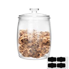 a glass jar filled with cookies on top of a white background