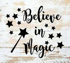 believe in magic with stars and the words above it on a white wooden background,