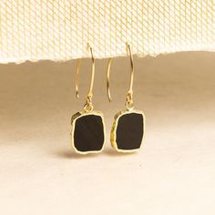 Raw Obsidian Gemstone Slice Earrings on 14k Gold Filled Earwires - Elegant black and gold earrings - Party, night out, wedding, every day NECKLACE SOLD SEPARATELY Stone: Genuine Black Obsidian Please note due to nature of our genuine stones no two are alike and the ones you will receive will vary slightly from the ones pictured in the photos. Bezel: Vermeil Gold Ear-wire: 14k Gold Filled Oval Gemstone: 16x12mm About "Gold Filled Jewelry": Also called rolled-gold. These jewelry items are not actu Gold Black Enamel Drop Earrings, Gold Drop Earrings With Black Enamel, Elegant Black Brass Jewelry, Black Minimalist Jewelry With Ear Wire, Black 14k Gold Earrings For Evening, Minimalist Black Linear Earrings For Gifts, Minimalist Black Linear Earrings As Gift, Minimalist Formal Earrings, Black Linear Earrings For Pierced Ears As Gift