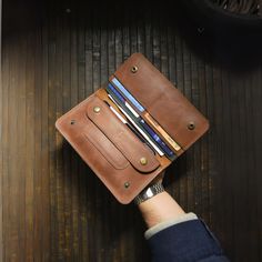 🔸Handcrafted Genuine Leather Wallet with Phone Case - The Ultimate Blend of Style and Functionality🔸 Immerse yourself in the artistry of our Genuine Leather Wallet, a meticulously handmade and handcrafted masterpiece that transcends the ordinary. This versatile accessory seamlessly combines the practicality of a traditional wallet with the modern touch of an integrated Phone Case, offering a perfect fusion of style and functionality for your everyday life. KEY FEATURES 🔸Premium Craftsmanship? Handmade Leather Travel Card Holder, Brown Wallets With Hidden Phone Sleeve, Handmade Leather Travel Wallets, Artisan Wallet With Interior Card Slots For Everyday, Artisan Wallet With Interior Card Slots, Brown Leather Wallet With Hidden Phone Sleeve, Hand Stitching Techniques, Traditional Accessories, Engraved Wallet