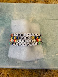 Pick your favorite NFL team to support! Colors will be specific for each team, but word(s) are customizable Black Letter, White Beads, Clay Beads, Chicago Il, Team Colors, Bead Bracelet, Spacer Beads, Favorite Team, Beaded Bracelet