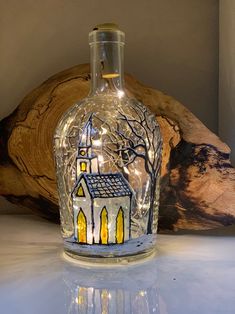 a glass bottle with a church on it