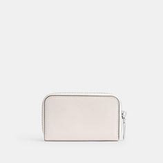 A modern minimalist design this convenient small card case is crafted of durable scratch-resistant crossgrain leather. Finished with our Signature hardware the slim style unzips to reveal three card slots and two open pockets with space for cash coins receipts and wireless earbuds or small accessories. | Coach Small Zip Around Card Case - Chalk Modern Card Holder With Zipper Closure For Daily Use, Modern Coin Purse With Zipper For Business, Modern Business Coin Purse With Zipper Closure, Modern Business Coin Purse With Zipper, Modern Coin Purse With Card Slots, Modern Coin Purse With Rfid Blocking For Business, Modern Coach Wallets With Interior Card Slots, Modern Business Coin Purse With Rfid Blocking, Modern Coach Wallet For Everyday Use