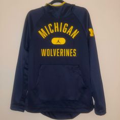 Jordan Men's Michigan Wolverines Umich Basketball Pullover Hoodie Navy Size M Sports Team Logo Hoodie For Winter, Blue Long Sleeve Hoodie For Team Spirit, Winter Team Logo Long Sleeve Sweatshirt, Winter Fleece Tops With Team Logo, Athleisure Tops With Adjustable Hood, Collegiate Sports Hoodie For Winter, Collegiate Hoodie For Winter Sports, Navy Sports Hoodie For Winter, Collegiate Winter Sports Hoodie