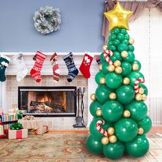 a christmas tree made out of balloons and stockings