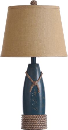 a table lamp with rope wrapped around it and a blue bottle on the bottom that says love