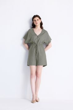 This chic V-neck Drawstring Romper is the perfect blend of comfort and style. Perfect for holidays, city adventures and everyday errands, this chic dark green hemp romper has a comfortable relaxed fit with a drawstring at the waist for that added definition. Details:Made from 100% HempRelaxed fitDrawstring at the waistPockets on both sidesGarment length for Size M is 34.5 inchesStasy is 5'9.5" and is wearing size XS Casual Olive Jumpsuits And Rompers For Spring, Khaki Jumpsuits And Rompers For Summer Loungewear, Green Linen Casual Jumpsuits And Rompers, Casual Green Linen Jumpsuits And Rompers, Casual Green Jumpsuits And Rompers With Tie Waist, Green Romper, Womens Dress Tops, Beach Holidays, Pajamas Gift