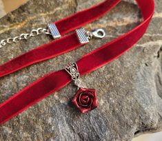 Velvet ribbon choker with sculpted flower. Material of rose is polymer clay. Each petal of flower made by hand Dia flower about 15 mm/ 0.55 " Length of necklace is adjustable: 10-12 inches/ 25,4 - 30,5 cm 11-13 inches/ 28-33 cm 12-14 inches/ 30.5- 35.5 cm 13-15 inches/ 33-38 cm 14-16 inches/ 35.5 cm-40.5 cm 15-17 inches/ 38,1 cm- 43,2 cm 16-18 inches/ 40.6 cm- 45.7 cm 17-19 inches/ 43 cm - 48 cm 18-20 inches/ 45,5- 50.8 cm Width of ribbon 10 mm / 0.4 inch Polymer clay isn't afraid of water, stro Clay Rose Necklace, Red Choker For Valentine's Day Gift, Flower Charm Choker As A Gift, Floral Choker With Flower Charm As A Gift, Flower Shaped Choker With Flower Charm As Gift, Gift Rose Design Choker In Rose Color, Rose Design Choker As Gift, Adjustable Ribbon Jewelry For Valentine's Day, Rose Design Choker Jewelry Gift