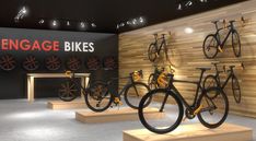 there are many bikes on display in the room with wooden walls and lights above them